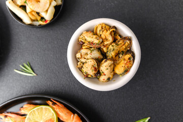Mussels in white bowl with herbs for seafood menu or healthy lifestyle concept