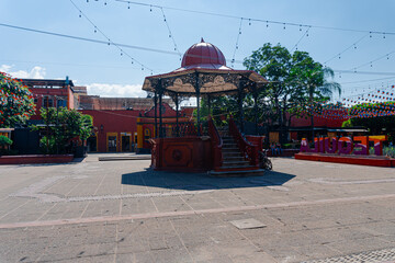 Kiosk and tequila sign in town square, jalisco, mexico