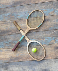 old wooden tennis racket on wooden background