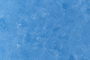 Textured blue plaster wall with soft cloud-like surface pattern