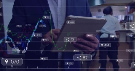 Restaurant manager tapping tablet by counter activating animated graphs and icons updating metrics - Powered by Adobe