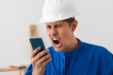 Construction worker screaming, angry and phone with man  for communication, frustrated and connection. Bad news, problem and corporate with male for difficult, annoyed and failure