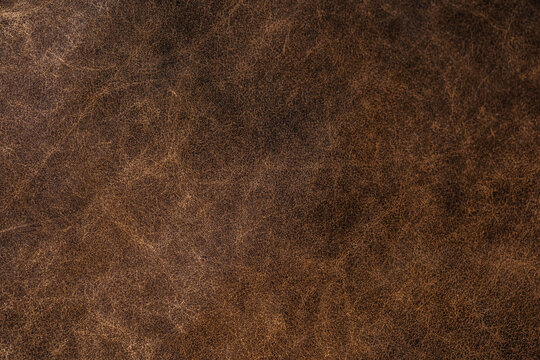 brown leather texture closeup for vintage material background and upholstery design concept