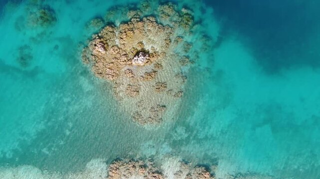 Stromatolite formation in the turquoise waters of Lake Salda. A unique geological formation resembling the structure of Mars. Aerial view captured by drone.