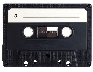 A close-up, top-down studio shot of a retro audio cassette tape