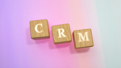 Wooden blocks spelling CRM on pastel background concept for Customer Relationship Management software and strategies for success