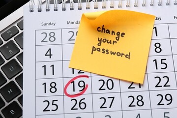 Note with phrase Change Your Password, calendar and laptop on table, flat lay