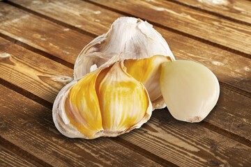 Group of fresh tasty organic garlic bulbs on desk