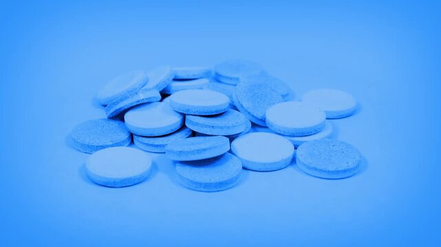 Medical Tablets Rotating In Pile