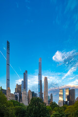 A stunning morning view of the slimmest and tallest skyscrapers on Billionaires Row, rising...