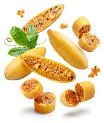 Curubas or banana passion fruits and fruit slices levitating in air on white background. File contains clipping paths.