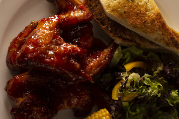 Golden fried chicken pieces on a plate, showing rich texture and seasoning, reflecting comfort food culture, protein nutrition, and the universal appeal of homemade fried dishes.