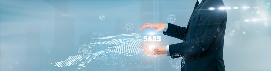 Businessman hand hold software as a service on global networking. Cloud platform, application...