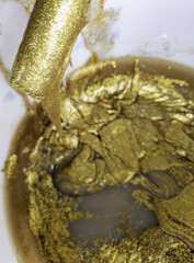 Can of gold paint