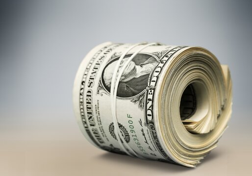 stack of money dollar bills on desk