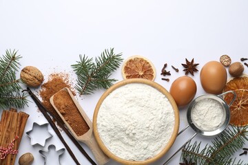 Christmas composition with cookie ingredients and fir tree branches on white background, flat lay