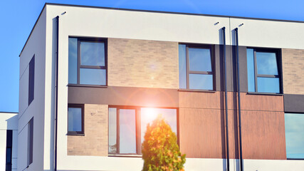 Newly built terraced houses in a residential area. Modern terraced houses on the outskirts of the city.