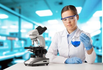 Portrait of scientist woman work with microscope for research.