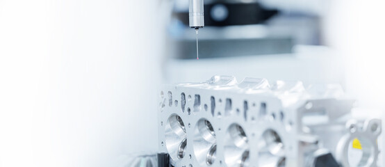 Cnc coordinate measuring machine inspecting engine block of car for precision engineering