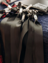 Checking in on conference congress forum event, registration desk table, visitors and attendees register electronic ticket and receiving black lanyard with name badge and entry wristband bracelet