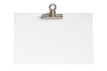 A single silver clip fastens a blank white note ready for a message or design isolated on a black background