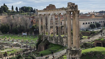 Rome, Italy - 13 January 2025. Temple of Saturn's towering columns overlook the Roman Forum, as...