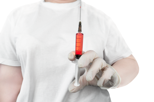 A healthcare professional in a white uniform holding a large syringe containing red liquid, symbolizing treatment or vaccination, isolated on transparent background