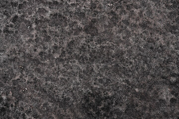 Black rock stone material with weathered prune texture