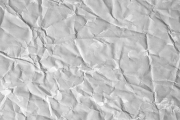 Crumpled grey paper texture with white stains