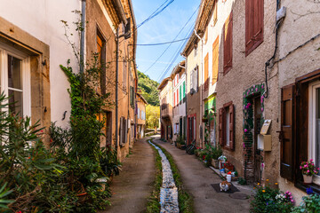 Narrow street in Durfort, in the Black Mountains, in the Tarn department, Occitanie region, France.