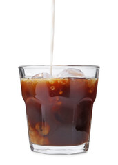 Pouring milk into iced coffee on white background, closeup