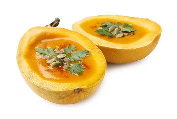 Tasty pumpkin cream soup with seeds and parsley isolated on white