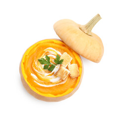 Tasty pumpkin cream soup with croutons and parsley in pumpkin isolated on white, top view