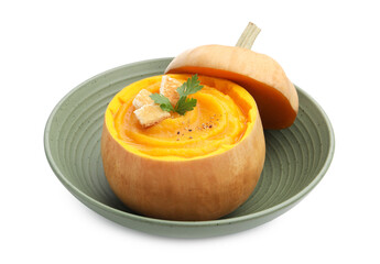 Tasty pumpkin cream soup with parsley and croutons served in pumpkin isolated on white