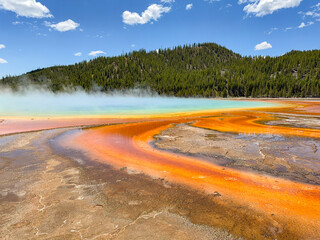Scenic view of water running from the Grand Prismatic Spring in Yellowstone National Park