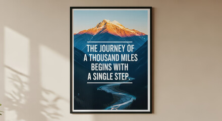 Framed motivational quote poster hanging on wall with phrase journey quote, journey of a thousand miles. Inspirational journey quote on poster with mountain and path.
