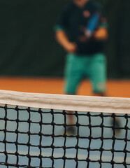 Tennis tournament championship on outdoor clay court with net, professional athletes play in motion...