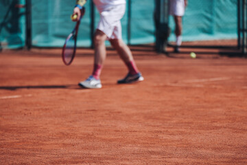 Tennis tournament championship on outdoor clay court with net, professional athletes play in motion...