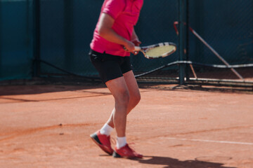 Tennis tournament championship on outdoor clay court with net, professional athletes play in motion with rackets serve tennis ball during tennis match game, tennis training in a sunny day on a stadium
