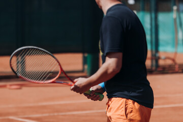Tennis tournament championship on outdoor clay court with net, professional athletes play in motion with rackets serve tennis ball during tennis match game, tennis training in a sunny day on a stadium