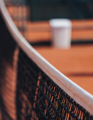 Tennis tournament championship on outdoor clay court with net, professional athletes play in motion with rackets serve tennis ball during tennis match game, tennis training in a sunny day on a stadium