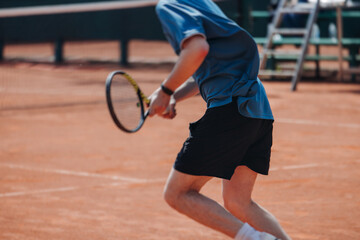 Tennis tournament championship on outdoor clay court with net, professional athletes play in motion with rackets serve tennis ball during tennis match game, tennis training in a sunny day on a stadium