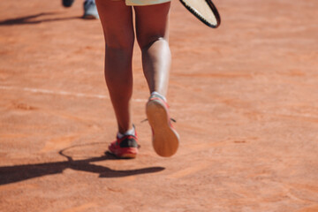 Tennis tournament championship on outdoor clay court with net, professional athletes play in motion...