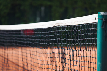 Tennis tournament championship on outdoor clay court with net, professional athletes play in motion...