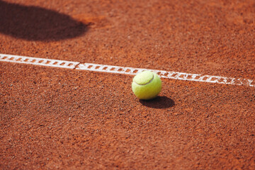 Tennis tournament championship on outdoor clay court with net, professional athletes play in motion with rackets serve tennis ball during tennis match game, tennis training in a sunny day on a stadium
