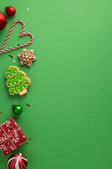 Bright vertical Christmas scene with candy cane heart, gingerbread star, decorated tree cookie, red...