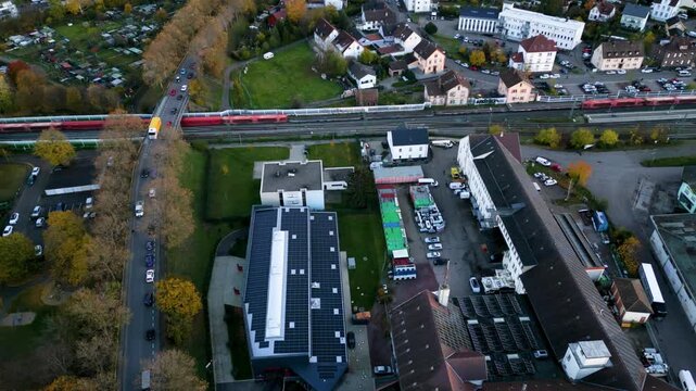 Red passenger train movement aerial view in Germany