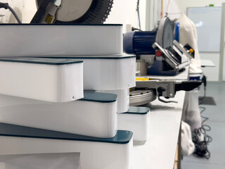 White Acrylic Channel Letters Prepared for Assembly