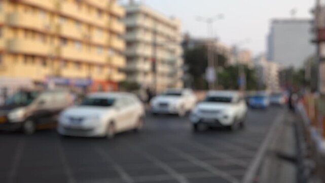 Bokeh view of road traffic at Netaji Subhash Chandra Bose Road (Marine drive) in Mumbai, India. Blurred background footage.