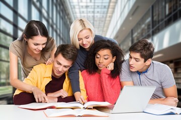 Diverse Group of happy Students Collaborating in a Modern Library.